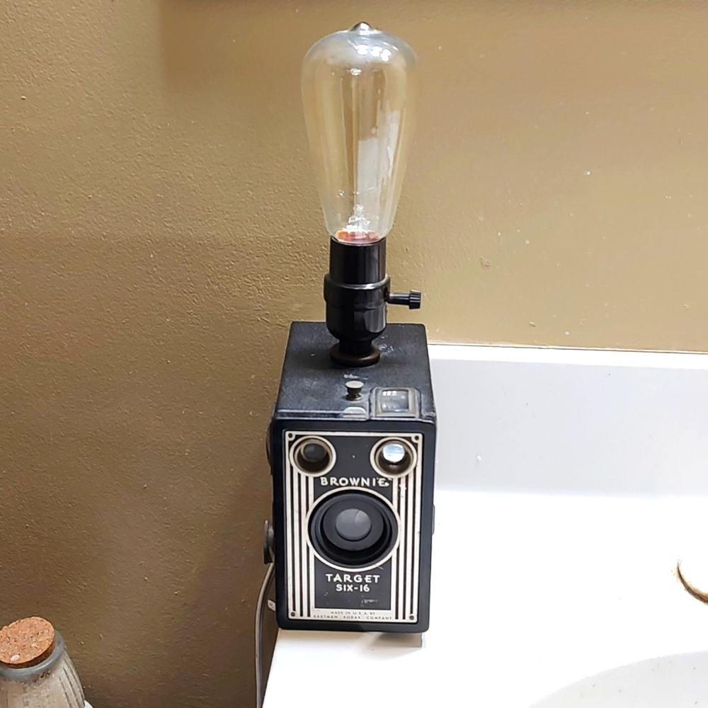 A beautiful vintage Kodak Brownie camera turned into a lamp with an Edison bulb